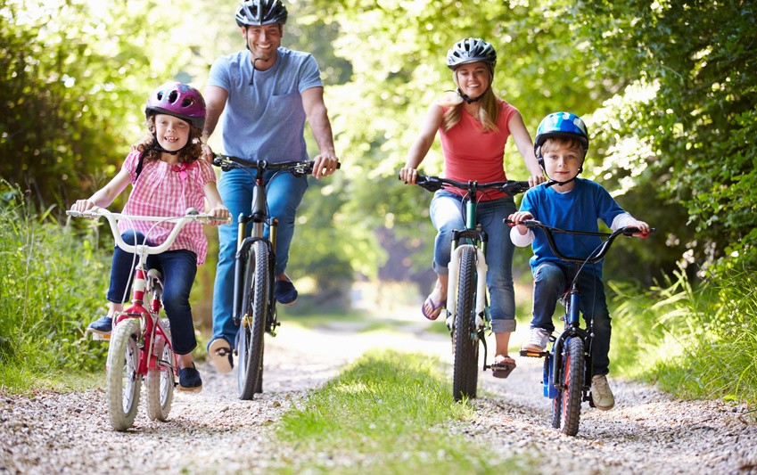 Family On Cycle Ride In Countryside